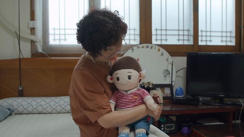 Aging_Korea_s_New_Best_Friend__Companion_Dolls_Rise_Amid_Population_Shifts_poster - 🌍NewspaperAmigo – Your Global News Buddy 🗞️ ___Aging_Korea_s_New_Best_Friend__Companion_Dolls_Rise_Amid_Population_Shifts video poster