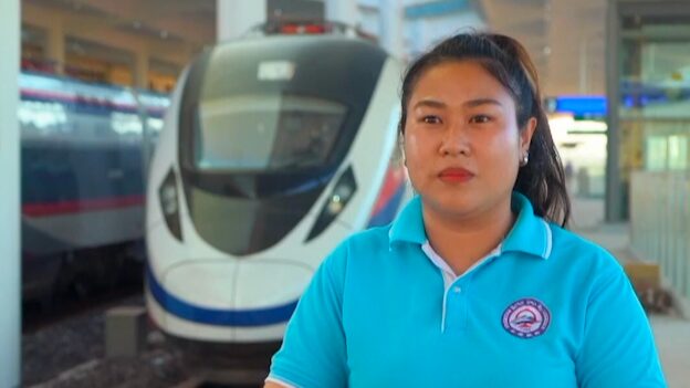 Breaking_Barriers__Laotian_Woman_Drives_Change_on_China_Laos_Railway_poster - 🌍NewspaperAmigo – Your Global News Buddy 🗞️ __Breaking_Barriers__Laotian_Woman_Drives_Change_on_China_Laos_Railway video poster
