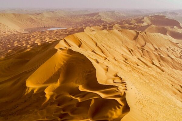 Discover Badain Jaran: China’s Desert of Hidden Lakes & Epic Dunes 🌄🏜️ Discover_Badain_Jaran__China_s_Desert_of_Hidden_Lakes___Epic_Dunes____