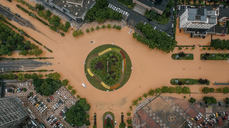 Heroic_Sacrifice__Man_Saves_Mother_Amid_China_Floods___ - 🌍NewspaperAmigo – Your Global News Buddy 🗞️ Heroic_Sacrifice__Man_Saves_Mother_Amid_China_Floods___