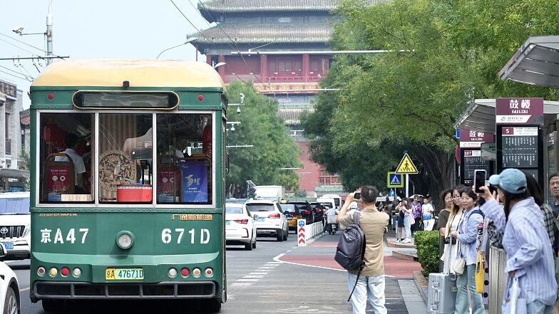 Hop_On__Sip_Tea__Explore_History__Beijing_s_Central_Axis_Bus_Tour___ - 🌍NewspaperAmigo – Your Global News Buddy 🗞️ Hop_On__Sip_Tea__Explore_History__Beijing_s_Central_Axis_Bus_Tour___