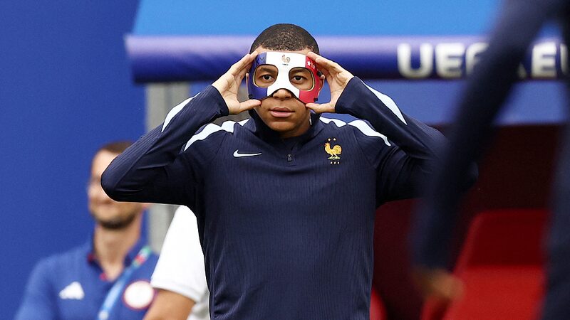 Mbappe__s_Flag_Mask_Banned_at_Euro_2024__UEFA_Rules_Block_Tricolor_Design__ - 🌍NewspaperAmigo – Your Global News Buddy 🗞️ ___Mbappe__s_Flag_Mask_Banned_at_Euro_2024__UEFA_Rules_Block_Tricolor_Design__