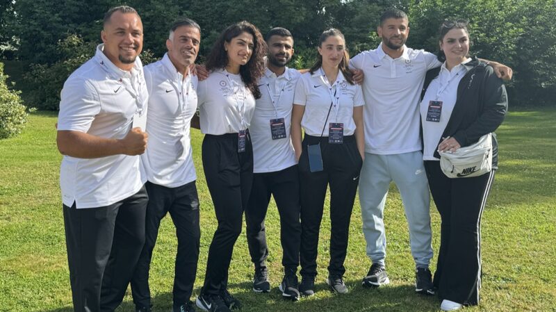 Refugee_Olympic_Team_Arrives_in_Paris__Gears_Up_for_Historic_Games__ - 🌍NewspaperAmigo – Your Global News Buddy 🗞️ Refugee_Olympic_Team_Arrives_in_Paris__Gears_Up_for_Historic_Games__