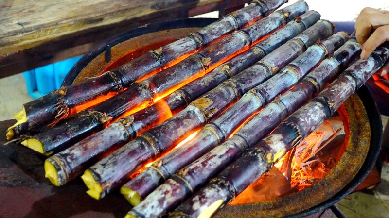 Sweet___Charred__Grilled_Sugarcane_Takes_Hainan_s_Snack_Scene_by_Storm___ - 🌍NewspaperAmigo – Your Global News Buddy 🗞️ Sweet___Charred__Grilled_Sugarcane_Takes_Hainan_s_Snack_Scene_by_Storm___
