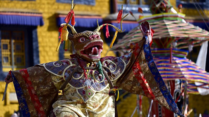 Vibrant_Cham_Dance_Lights_Up_Lhasa_for_Tibetan_New_Year__ - 🌍NewspaperAmigo – Your Global News Buddy 🗞️ Vibrant_Cham_Dance_Lights_Up_Lhasa_for_Tibetan_New_Year__