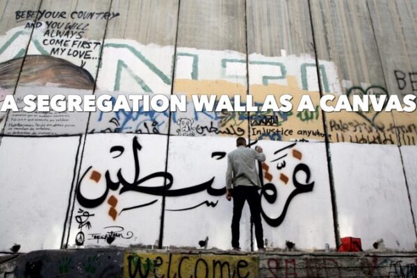 West Bank Wall Becomes Canvas for Palestinian Artist’s Protest 🎨✊ West_Bank_Wall_Becomes_Canvas_for_Palestinian_Artist_s_Protest___ video poster