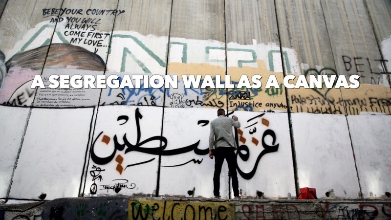 West_Bank_Wall_Becomes_Canvas_for_Palestinian_Artist_s_Protest____poster - 🌍NewspaperAmigo – Your Global News Buddy 🗞️ West_Bank_Wall_Becomes_Canvas_for_Palestinian_Artist_s_Protest___ video poster
