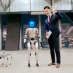 China_s_Humanoid_Robot___Robo_Dog_Take_Over_Media_Studio_in_Futuristic_Tech_Showcase___poster - 🌍NewspaperAmigo – Your Global News Buddy 🗞️ China_s_Humanoid_Robot___Robo_Dog_Take_Over_Media_Studio_in_Futuristic_Tech_Showcase__ video poster