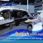 ETR84LGHJ68YCDO31QAJ - 🌍NewspaperAmigo – Your Global News Buddy 🗞️ British Youth Drives into China's Booming EV Scene at Consumer Expo 🌱🚗 video poster