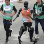 TJ4HEJABLL8Y9WKSUILN - 🌍NewspaperAmigo – Your Global News Buddy 🗞️ 🤖🏃 Beijing Hosts World’s First Humanoid Robot Half-Marathon! video poster