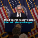 UA847AJBCT8GYR0RX25B - 🌍NewspaperAmigo – Your Global News Buddy 🗞️ Fed Hits Pause on Rate Cuts Amid Economic Uncertainty 💸📉 video poster