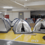 EBZLXSG0G7K5NQO6S6GK - 🌍NewspaperAmigo – Your Global News Buddy 🗞️ Tel Aviv Parking Lot Transforms into Shelter Amid Iran-Israel Tensions 🚨🛡️ video poster