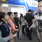F9K1LVL9J95RFO26E1HV - 🌍NewspaperAmigo – Your Global News Buddy 🗞️ 🤖 Tesla Bot Steals the Show at Hangzhou’s Robot Expo 2025 🌟
