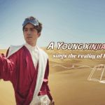 KKXVJWSZE3Y13WMSRPHH - 🌍NewspaperAmigo – Your Global News Buddy 🗞️ Xinjiang Artist Sings Homeland's Truth in New Music Video 🎶🌄 video poster