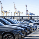 GNQRJKW6X8Z1N5NYN9P0 - 🌍NewspaperAmigo – Your Global News Buddy 🗞️ 🚨 EU Port Overflows with Stranded Cars as Trump Tariffs Loom 🌍🚗