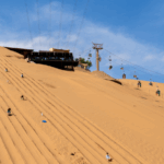 O6C7G5D0HVDRDB866E90 - 🌍NewspaperAmigo – Your Global News Buddy 🗞️ Shapotou's Sandboarding Craze: Desert Thrills Go Viral 🌵🏄♂️