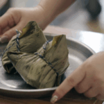 UGFUZNUA4MQZ5WLHCZE7 - 🌍NewspaperAmigo – Your Global News Buddy 🗞️ 🍙✨ Taiwan’s Salted Egg Zongzi: A Bite of History & Symbolism video poster
