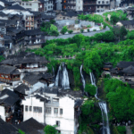 UVQ4S858CDCRWQ1O7PN7 - 🌍NewspaperAmigo – Your Global News Buddy 🗞️ China’s Waterfall Wonder: Ancient Town Offers Cinematic Summer Escape 🌊🏮