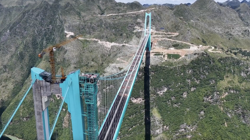 KN3MAGP5Z3RE10U2JSJD - 🌍NewspaperAmigo – Your Global News Buddy 🗞️ China’s Huajiang Bridge Set to Shatter World Records 🌉🏆 video poster