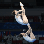 M3V1NJ3JS6P3PP4ZRRI7 - 🌍NewspaperAmigo – Your Global News Buddy 🗞️ 🇨🇳 China Soars to Gold in Women's Trampoline Sync at Chengdu World Games! 🥇