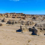 7A4B5GSDEOE4ALB45837 - 🌍NewspaperAmigo – Your Global News Buddy 🗞️ Explore Xinjiang's Epic Yardang Landscapes: Where Nature Meets Cinema 🎥🏜️ video poster