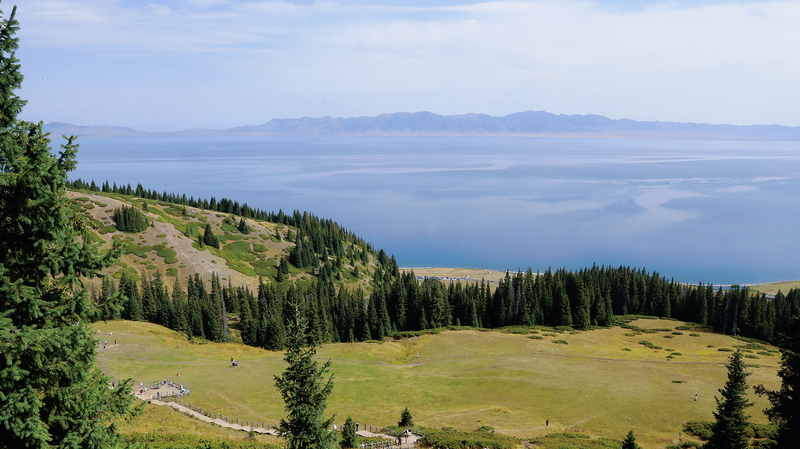 G5XDQX2YL75VIBV3M4AY - 🌍NewspaperAmigo – Your Global News Buddy 🗞️ Nature's Magic: Xinjiang's Songshutou & Sayram Lake 🌲🌊 video poster
