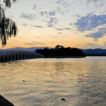 PNF2AWB3S71S1GQ7KGS4 - 🌍NewspaperAmigo – Your Global News Buddy 🗞️ Beijing's Summer Palace Glows in Stunning Sunset Spectacle 🌅✨