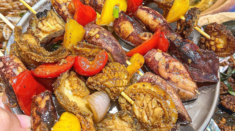 R6FNZSVT9QN9RGKDW1MB - 🌍NewspaperAmigo – Your Global News Buddy 🗞️ Hainan's Xincun Night Market: Where Food Meets Culture 🌟🍜