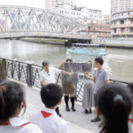 VJAY9XECCTCXMZWCIU6D - 🌍NewspaperAmigo – Your Global News Buddy 🗞️ Shanghai's Historic 'Eight Hundred Warriors' Walk Honors WWII Heroes 🏙️🇨🇳 video poster