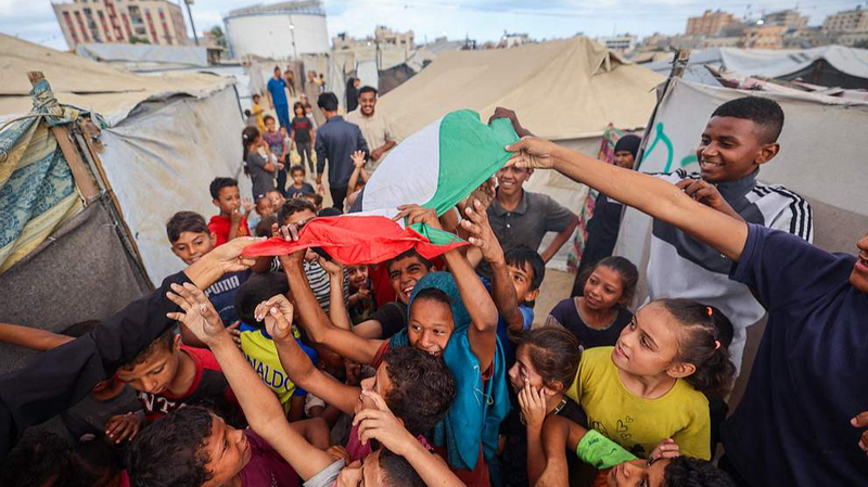 GXCLP5L2ZISNURI2VVDU - 🌍NewspaperAmigo – Your Global News Buddy 🗞️ Gaza Ceasefire Deal Reached: Global Leaders React 🌍✌️