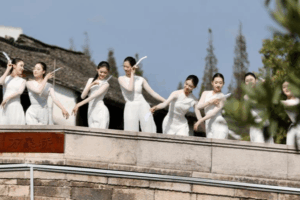 N6S77PBKCM5YZFEBYP1B - 🌍NewspaperAmigo – Your Global News Buddy 🗞️ Xinshi Water Town Revives Tradition with Dance Art Festival 🌊🎨