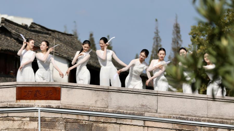 N6S77PBKCM5YZFEBYP1B - 🌍NewspaperAmigo – Your Global News Buddy 🗞️ Xinshi Water Town Revives Tradition with Dance Art Festival 🌊🎨