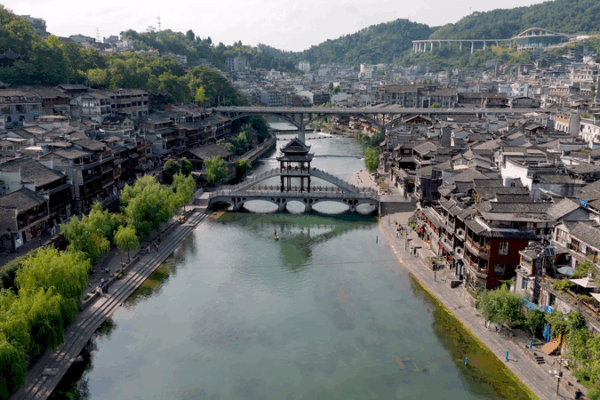 Discover Fenghuang: Hunan’s Ancient Water Town 🌊🏮 video poster