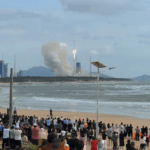 AOC42NFYMIJ09045XXL1 - 🌍NewspaperAmigo – Your Global News Buddy 🗞️ Hainan’s Space Tourism Soars as Rocket Launches Attract Global Visitors 🚀🌴 video poster