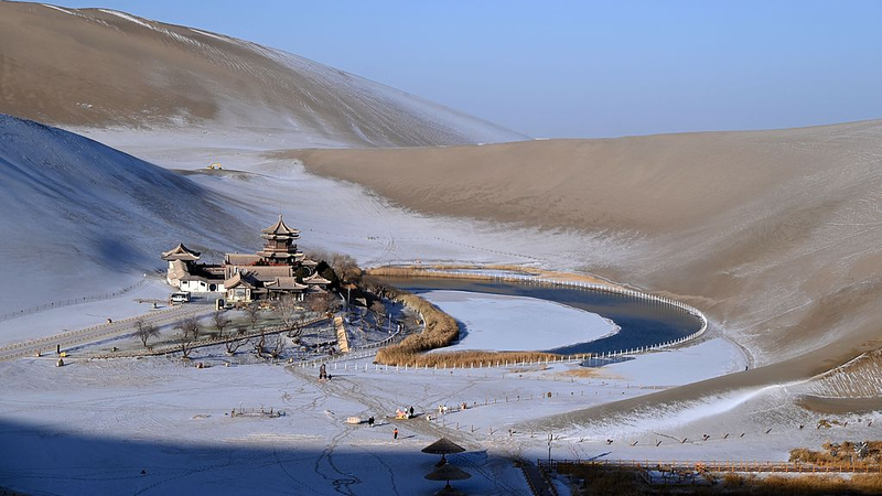 Winter Magic at Mingsha Mountain: Snow-Capped Dunes & Crescent Spring 🌨️🏜️ video poster