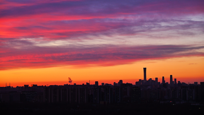 Beijing Dawns in Color: Skyline Glows After Pollution Milestone 🌅