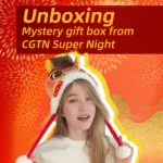 97D6MAMLEB79Y959KXK1 - 🌍NewspaperAmigo – Your Global News Buddy 🗞️ Inside the CGTN Super Night Gift Box: Belarusian Star Anna Unwraps Cultural Treasures 🎁 video poster