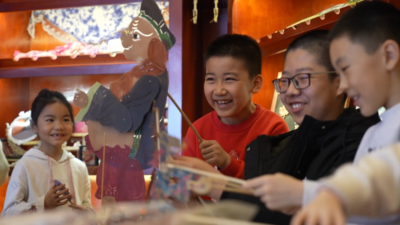 KR8RK7UBJY1PPGMRS6MP - 🌍NewspaperAmigo – Your Global News Buddy 🗞️ Shadow Puppets Shine in Xinjiang’s Spring Fest 🎭✨ video poster