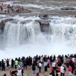 Nature’s Spectacle: Hukou Waterfall’s Peach Blossom Flood 🌸🌊 video poster