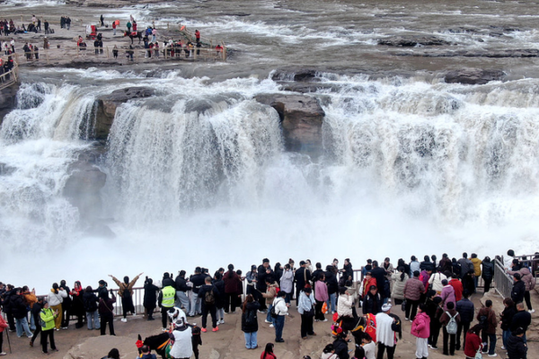 Nature’s Spectacle: Hukou Waterfall’s Peach Blossom Flood 🌸🌊 video poster