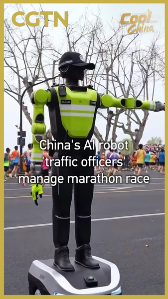 HP2B7AB7EGI8HP0O0ERF - 🌍NewspaperAmigo – Your Global News Buddy 🗞️ AI Robot Traffic Officers Debut at 2026 West Lake Marathon 🏃♂️🤖 video poster